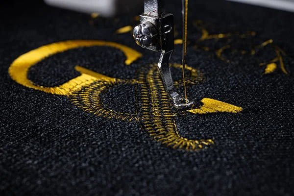 Professional golf shirt embroidery services and custom logo placement