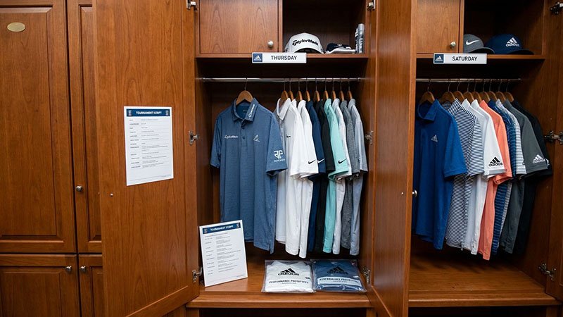 Professional golfer's tournament apparel A professional golfer's locker filled with branded shirts for a tournament week